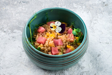 Healthy food poke bowl with tuna, fresh vegetables and Hawaiian sauce. Hawaiian meal poke bowl with...