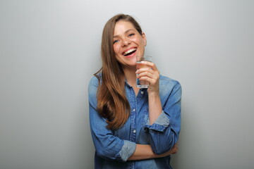 Water with clear glass smiling woman holding near her face. isolated female portrait.