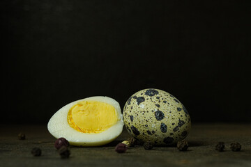 Fresh quail eggs close up on a wooden table small hard boiled eggs rustic top view