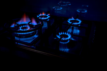 Gas cooktop burning gas stove with blue flame