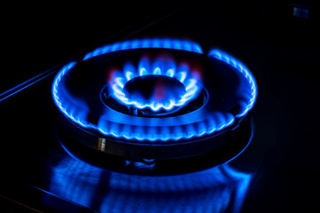 Gas cooktop burning gas stove with blue flame