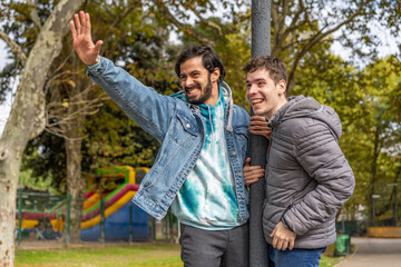 Latin gay couple having fun at a park