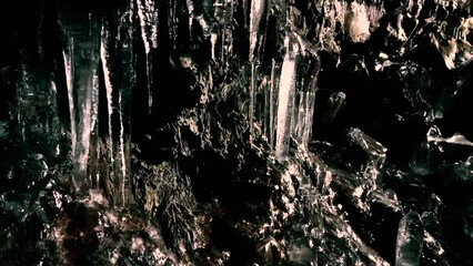 Lava Tunnel Tube Views Lava with ice formations and a volcanic rock background. - Powered by Adobe