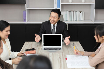 Collaborative process of professional businesspeople going over on new project together, using computer presentation and brainstorming ideas, coworker and working together at office meeting concept