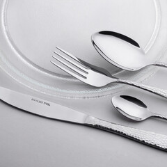 cutlery set spoon fork knife small spoon on a plate
