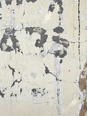 Foto op Plexiglas Verweerde muur Letters on a White Brick or Concrete Wall with Peeling White Paint