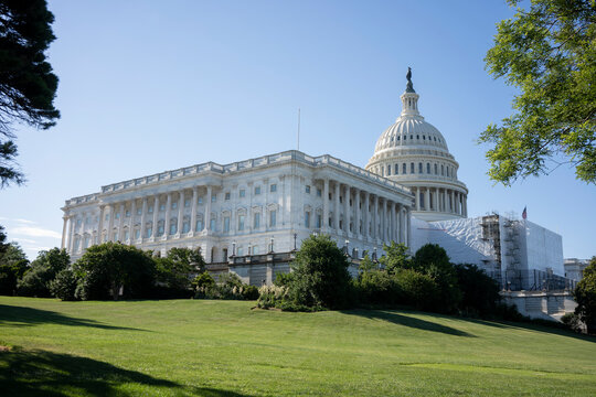 The U.S. Capitol, A Domed Classical Building Housing The U.S. Senate And House Of Representatives, With Its West Front Covered In Scaffolding For Maintenance.