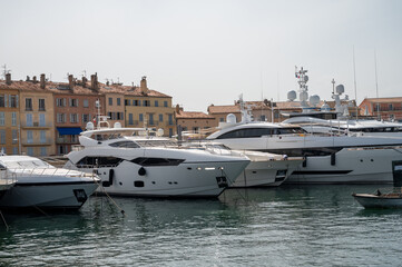 Colorful houses and yachts in Port of Saint Tropez, village on Mediterranean sea with yacht harbour, Provence, France