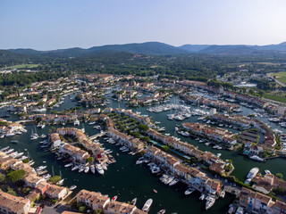 Obraz premium Aerial view on Gulf of Saint-Tropez, sail boats, houses of Port Grimaud and Port Cogolin, summer vacation in Provence, France