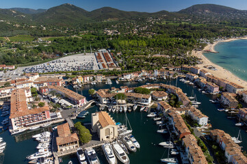 Obraz premium Aerial view on Gulf of Saint-Tropez, sail boats, houses of Port Grimaud and Port Cogolin, summer vacation in Provence, France