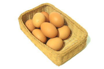 Eggs in basket isolated on white background