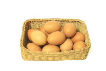 Eggs in basket isolated on white background