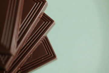 chocolate pieces on white background