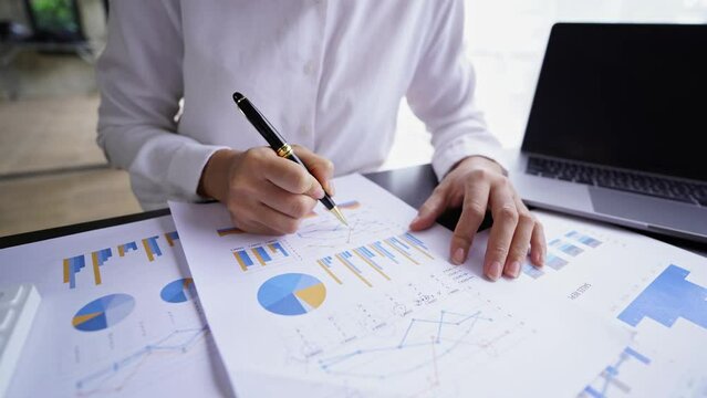 Investor analyzing finance estimation charts, financial analytics, business man working on investment plan in office