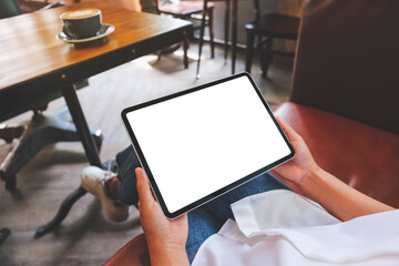 Mockup image of a woman holding digital tablet with blank white desktop screen