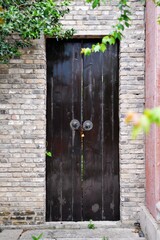 a locked wooden door in traditional Chinese style