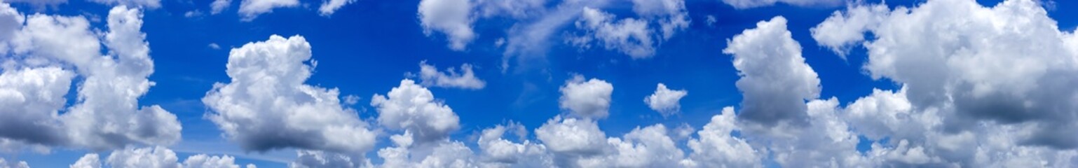 Naklejka na ściany i meble Beautiful blue sky background with tiny clouds.Panorama