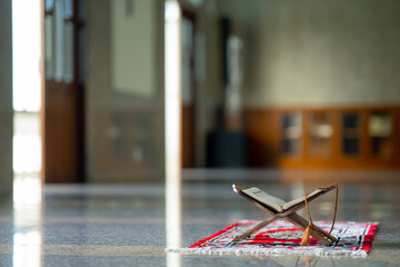 Islamic concept - The Holy Al Quran with written Arabic calligraphy meaning of Al Quran and rosary...
