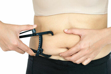 Fat woman weighs a lot, she measures excess fat around the waist She's fat because of fatty food.