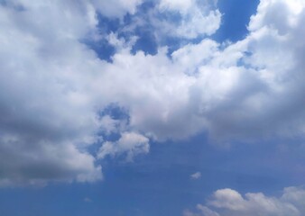 Naklejka na ściany i meble nature portrait of clouds among blue sky in the horizon