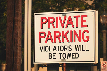 Fototapeta na wymiar Private parking violators will be towed sign