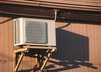 Outdoor air conditioner unit on building