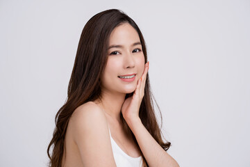 Beautiful Asian girl with fresh clean skin touching her face, facials, beauty, beauty and spa.