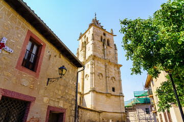 Fototapeta na wymiar Gothic tower of the church of Torrelaguna, rising towards the blue sky, Madrid.