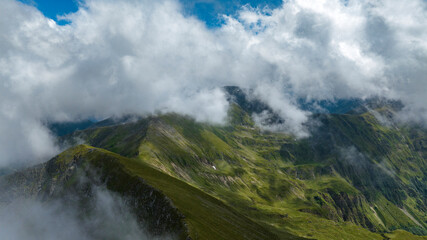 aerial view of mountains with clouds 