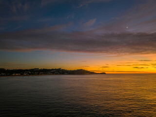 Sunrise over the sea with high cloud