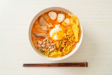 egg noodles with pork and meatball in spicy soup