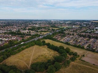 Aerial footage by drone high angle view of London Luton City Center of England with Buildings