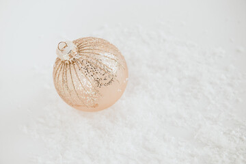 festive christmas ball on white background with snow