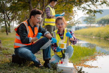 Scientists team collect water samples for analysis and research on water quality, environment with...