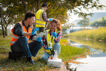 Scientists team collect water samples for analysis and research on water quality, environment with...