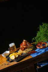 rustic pork knuckle with sauerkraut, sweet mustard and fried potatoes