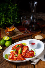 chicken wings with potato wedges and sezam.