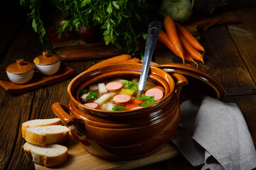 Potato kohlrabi soup with bockwurst
