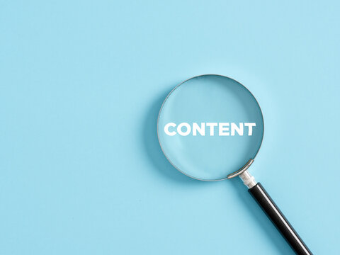 Magnifier with the text content on blue background. Content search and optimization