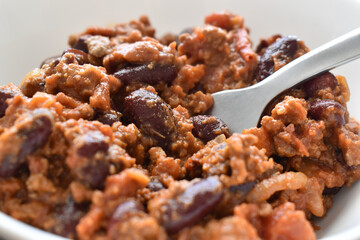 Chilli con carne in a white bowl.  Traditional Mexican food.