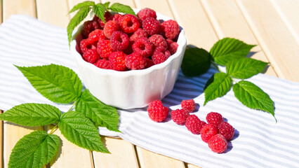 Bowl with ripe delicious raspberries