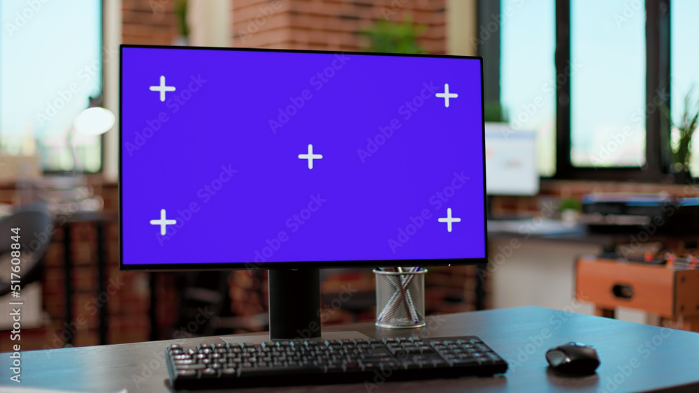 Poster Nobody at desk with greenscreen template on computer monitor in business company office. Desktop with blank mockup background on display with isolated copyspace chroma key on pc.