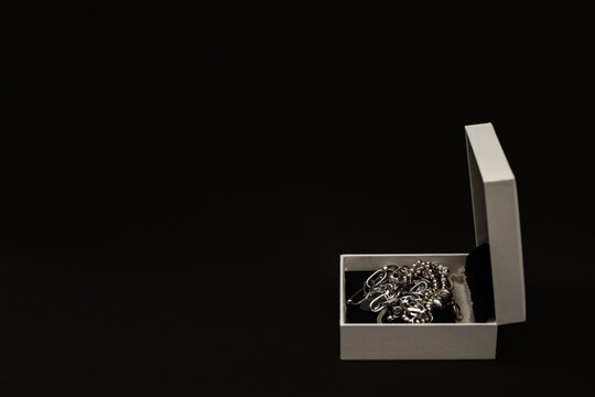 Silver And White Gold Jewelry In A White Box