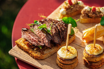 Closeup on roast beef and mushroom bruschettas on banquet