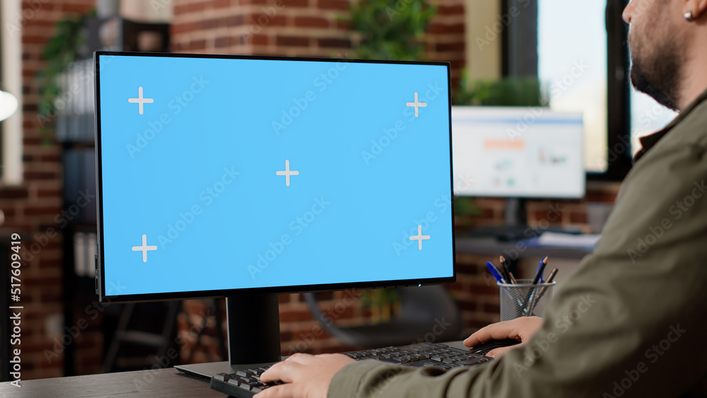 Poster businessman working on monitor with greenscreen template, using isolated copyspace desktop on comput