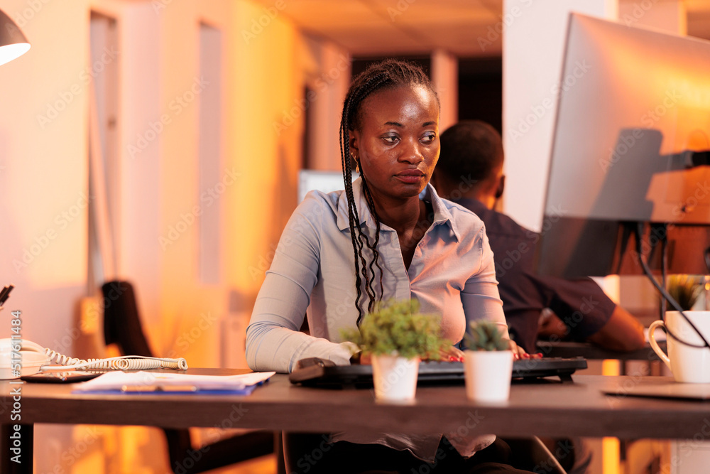 Poster african american freelancer doing startup project data on computer, using research information to cr