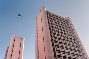 skyline with an airplane, kenzo tange, bologna, fiera, architecture.