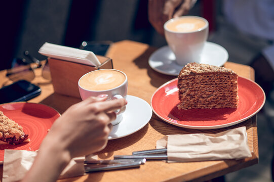 Close up ogf a table with coffee and desert