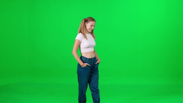 Female walking down the street on a green background, a passerby on a walk, chroma key template, young woman in a white t-shirt and blue jeans, citizen.