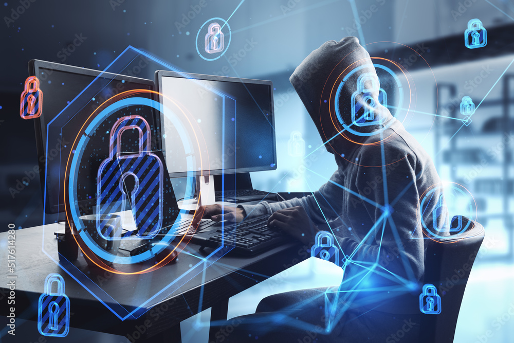 Poster hacker sitting at desktop in blurry office interior and using computer monitors with abstract glowing connected digital padlock hologram. Computer safety, hacking, data theft and secure concept. 